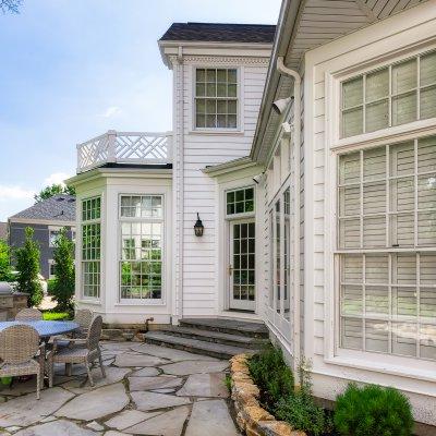 exterior side view of Hyde Park addition and stone patio Wilcox Architecture